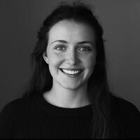 Black and white headshot of a female graduate student with a nice smile